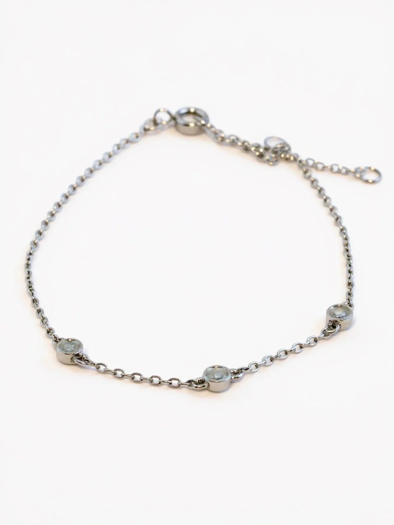 Minimalist silver bracelet with three zircon stones