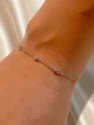Minimalist silver bracelet with three zircon stones