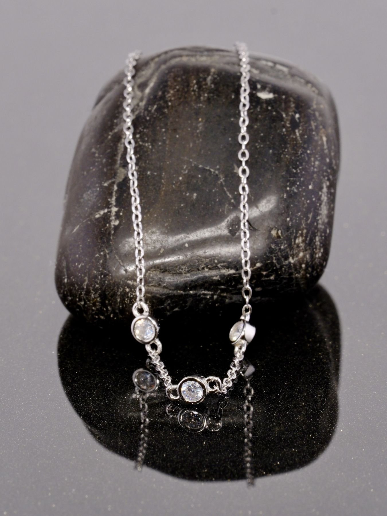 Minimalist silver bracelet with three zircon stones