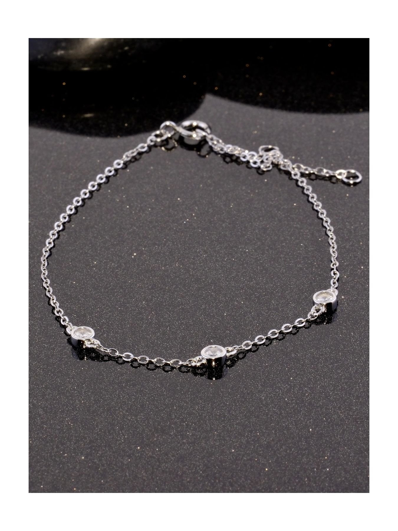 Minimalist silver bracelet with three zircon stones